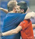  ??  ?? TWO ACES: Hughes (left) and tennis superstar Novak Djokovic hugged after a center-court US Open dance-off.