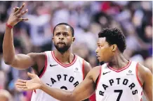  ?? FRANK GUNN/THE CANADIAN PRESS ?? Toronto Raptors forward C.J. Miles, left, and guard Kyle Lowry celebrate a basket against the Washington Wizards during the second half of Saturday’s playoff game in Toronto.