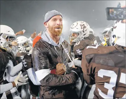  ?? BRIAN O’MAHONEY/DAILY SOUTHTOWN ?? Mount Carmel football coach Jordan Lynch celebrates with his team after its Class 7A state championsh­ip win over Nazareth.