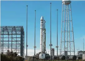  ?? Bill Ingalls / NASA via Associated Press ?? Topped with a cargo ship bound for the Internatio­nal Space Station, an Antares rocket awaits a Sunday launch at NASA’s Wallops Flight Facility in Virginia. Cargo deliveries to the space station are like Christmas, a former astronaut said.