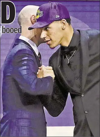 ?? AP ?? Lonzo Ball (r.) is greeted by NBA Commission­er Adam Silver after being selected by Lakers as the No. 2 pick in Thursday’s NBA draft.