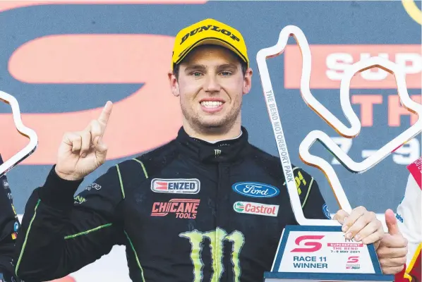  ??  ?? Cameron Waters celebrates after winning race 3 of the OTR Supersprin­t at The Bend on Sunday. Picture: Getty Images