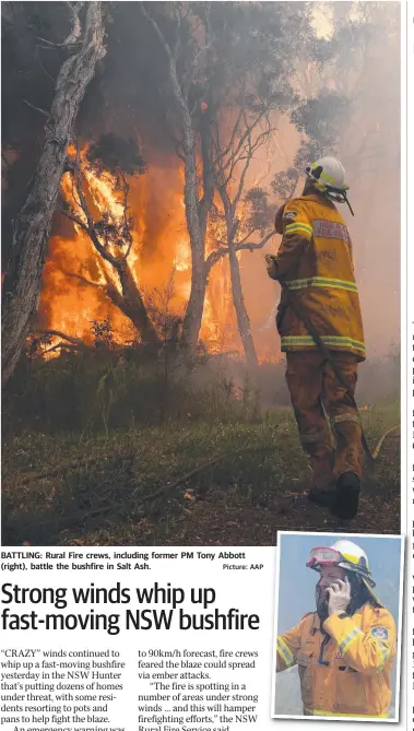  ?? Picture: AAP ?? BATTLING: Rural Fire crews, including former PM Tony Abbott (right), battle the bushfire in Salt Ash.