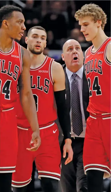  ?? NAM Y. HUH/AP ?? Coach Jim Boylen talks to Bulls players (from left) Wendell Carter Jr., Zach LaVine and Lauri Markkanen during a timeout last December. The Bulls ended several months of wondering when they fired Boylen on Friday.