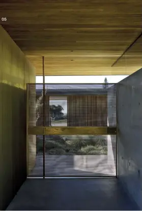  ??  ?? 05 The house is entered via a bespoke brass gate that offers glimpses of the courtyard garden.