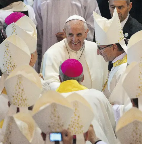  ?? GABRIEL BOUYS / AFP FILES ?? Pope Francis is greeted in Rio de Janeiro during a 2013 visit. The Pope is considerin­g a partial lifting of priestly celibacy.