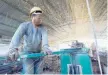  ?? — Reuters ?? A labourer cuts steel bars at a railway bridge constructi­on site in province of Lianyungan­g in China.