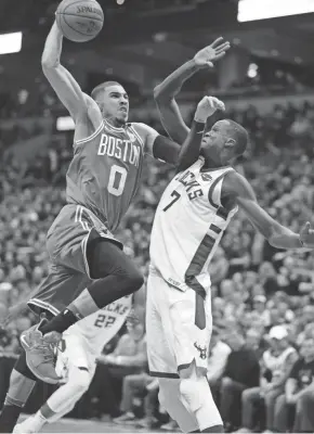  ?? MARK HOFFMAN / MILWAUKEE JOURNAL SENTINEL ?? Milwaukee Bucks center Thon Maker fouls Boston Celtics forward Jayson Tatum during the second half.