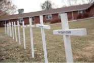  ??  ?? White crosses on the lawn of Good Samaritan Society nursing home Dec. 8, 2020, in Canton, S.D., commemorat­e residents who have died in recent weeks of the coronaviru­s. (AP Photo/Stephen Groves)