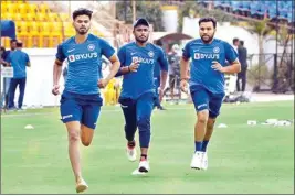  ??  ?? Indian cricket team captain Rohit Sharma (R) with teammates during a practice session ahead of their second T20 match against Bangladesh, at Khanderi Stadium in Rajkot