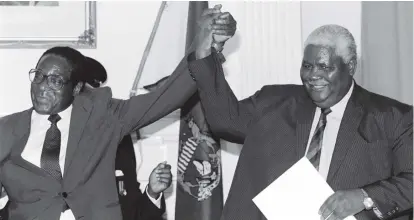  ??  ?? President Mugabe and the late Vice President Dr Joshua Mqabuko Nkomo after the signing of the Unity Accord