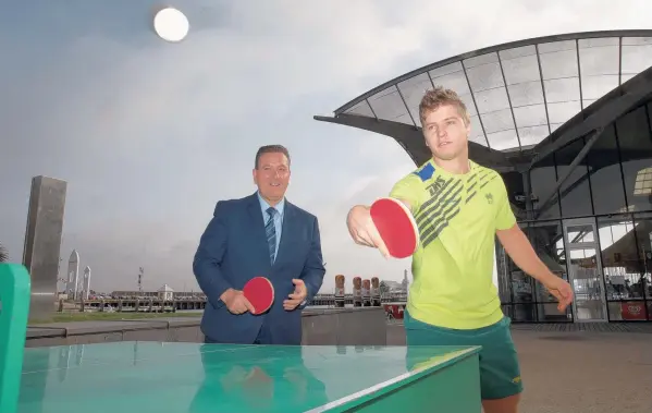  ?? Picture: ALISON WYND ?? ADVANTAGE: Sports Minister John Eren and star Aussie table tennis player Wade Townsend in Geelong yesterday.