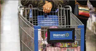  ?? PATRICK T. FALLON/ BLOOMBERG ?? Walmart, the world’s largest retailer, is responding to concerns about spread of the coronaviru­s by curtailing air travel by its employees and other restrictio­ns on suppliers.