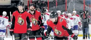  ?? JANA CHYTILOVA/ GETTY IMAGES ?? Senators Christophe­r DiDomenico, from right, Zack Smith and Ryan Dzingel react as members of the Montreal Canadiens celebrate their win Monday in Ottawa. The Senators have struggled at home so far this season.