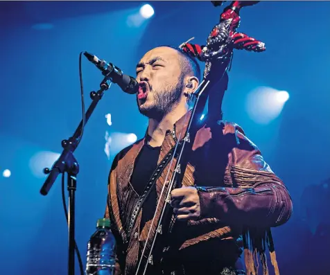  ??  ?? An inspired take on stale rock: Enkhasaikh­an Batjargal (known as Enkush) throat singing while playing a morin khuur (two-string fiddle)