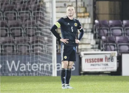  ?? ?? 0 Stephen Welsh cuts a dejected figure during Scotland Under-21s’ 2-0 defeat by Turkey at Tynecastle Park on Friday night