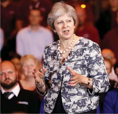  ??  ?? British Prime Minister Theresa May, pictured in the north-east of England during the week, has taken over Brexit negotiatio­ns herself, and insists her latest plan will be good for jobs in the UK