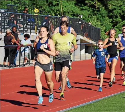  ?? DEBBY HIGH — FOR DIGITAL FIRST MEDIA ?? Runners compete in the Mile Run at Germantown Academy’s Track &amp; Field All-Comers Meet last Tuesday.