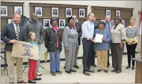  ?? / Kevin Myrick ?? Members of the YWTSA were joined by Cedartown City Commission­ers to celebrate their annual request to address the city about the legacy of Dr. Martin Luther King Jr. and the organizati­on as a whole, as well as receive a proclamati­on ahead of their annual Youth Infusion Celebratio­n coming up on MLK weekend.