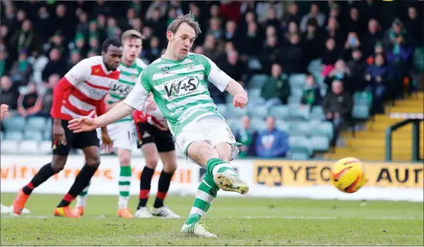  ?? PICTURES: Pinnacle ?? KEEPING CALM: Yeovil Town’s James Hayter scores from the penalty spot