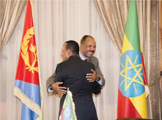  ??  ?? ETHIOPIA’S PRIME Minister Abiy Ahmed and Eritrean President Isaias Afwerk embrace at the declaratio­n signing in Asmara, Eritrea on July 9.