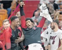  ?? MICHAEL LAUGHLIN/SUN SENTINEL ?? The Heat’s Josh Richardson (holding towel) had his moments on the bench and on the court Wednesday night against the Pelicans.