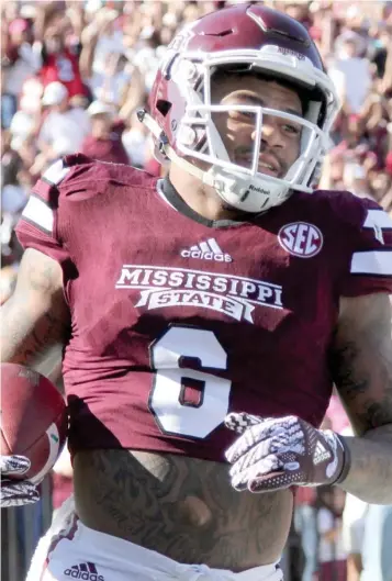  ?? Cleveland, SDN) (Photo by Jason ?? Wide receiver Donald Gray scores a touchdown for Mississipp­i State last season.