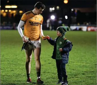  ?? Photo by Diarmuid Greene / Sportsfile ?? Kerry goalkeeper Shane Ryan gives his kicking tee to Kerry supporter Gary Parker, aged 8, after Kerry’s victory over Dublin on Saturday evening