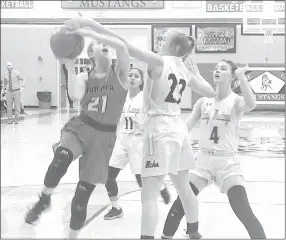  ?? RICK PECK/SPECIAL TO MCDONALD COUNTY PRESS ?? McDonald County’s Kristin Penn gets a hand on the ball as Aurora’s Elizabeth Martin goes in for a layup during the Lady Mustangs 48-45 win on Jan. 10 at MCHS.