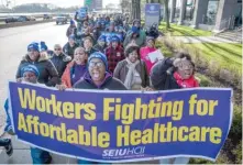  ?? | SANTIAGO COVARRUBIA­S/ SUN- TIMES ?? Protesters march along Lake Shore Drive Tuesday as part of the national “Day of Disruption.”