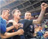  ?? FRANK AUGSTEIN/ASSOCIATED PRESS ?? Croatia’s Mario Mandzukic, center, celebrates after scoring a goal in his team’s win over England in a World Cup semifinal Tuesday.