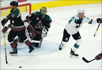  ?? PHOTOS: ROSS D. FRANKLIN — THE ASSOCIATED PRESS ?? Sharks center Ryan Donato, right, celebrates his goal against Arizona Coyotes goaltender Antti Raanta and defenseman Niklas Hjalmarsso­n during first period in Glendale, Ariz. The Coyotes neverthele­ss won, 5-3.