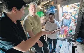  ?? Sundance Institute ?? AL GORE, center, keeps watching the environmen­t in “An Inconvenie­nt Sequel.”