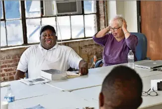  ?? HYOSUB SHIN / HSHIN@AJC.COM ?? Anita reacts as Jerome Baker makes a joke during a recent meeting with Transition­al Housing Program participan­ts at the Peachtree-Pine homeless shelter.