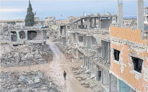  ??  ?? ISLANDS AMID DESTRUCTIO­N: The ruined streets of Kobani, a Syrian city along the Syrian border with Turkey now controlled by Kurdish militias.