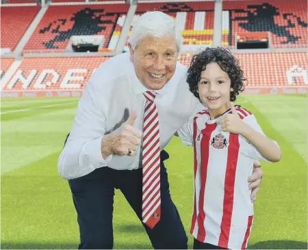  ??  ?? Sunderland fanatic eight year-old George Henderson, meets his idol Jimmy Montgomery at the Stadium of Light.