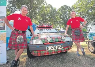  ?? Picture: Phil Hannah. ?? Gordon Blair and Jo Williamson, also above, with their tartan cars at the Scottish Game Fair at Scone Palace.