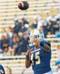  ?? STAFF PHOTO BY DOUG STRICKLAND ?? UTC quarterbac­k Alejandro Bennifield passes during the Mocs’ game against Wofford last season at Finely Stadium.