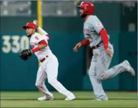  ?? LAURENCE KESTERSON — THE ASSOCIATED PRESS ?? Phillies shortstop J.P. Crawford, throwing out the Reds’ Jose Peraza on a ground ball Tuesday night, broke a lengthy slump with a go-ahead single Tuesday night in the Phillies 6-1 win.