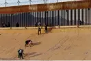  ?? Photograph: José Luis González/Reuters ?? Asylum-seeking migrants walk out of the Rio Bravo river after crossing it to turn themselves in to US border patrol agents in El Paso, Texas, as seen from Ciudad Juarez, Mexico, 6 October.