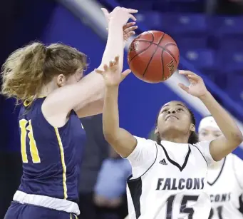  ?? PAUL CONNORS / BOSTON HERALD ?? ANYONE’S BALL: Cambridge’s Sophia Vital, right, and Andover’s Amelia Hanscom battle for a loose ball during their MIAA North title game held at the Tsongas Center on Saturday night in Lowell.