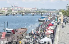  ??  ?? CZECH MATES: The weekend farmers’ market takes place next to the Vltava River, which slides through Prague like a serpent.