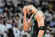  ?? Wilfredo Lee/Associated Press ?? Boston Celtics forward Jayson Tatum reacts during the second half of Game 3 of the NBA Eastern Conference finals against the Miami Heat on Sunday.