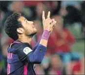  ??  ?? Barcelona's Brazilian forward Neymar da Silva celebrates after scoring during the Spanish league football match against Granada FC at Nuevo Los Carmenes stadium in Granada.