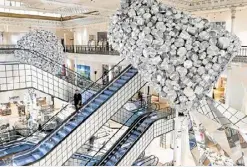  ?? ?? LOOMING A huge assembly of kitchen utensils dominates the iconic Le Bon Marché department store in Paris on Jan. 9.