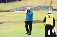  ?? AFP ?? Sandy Lyle wipes away a tear after probably his last appearance in an Open Championsh­ip. —