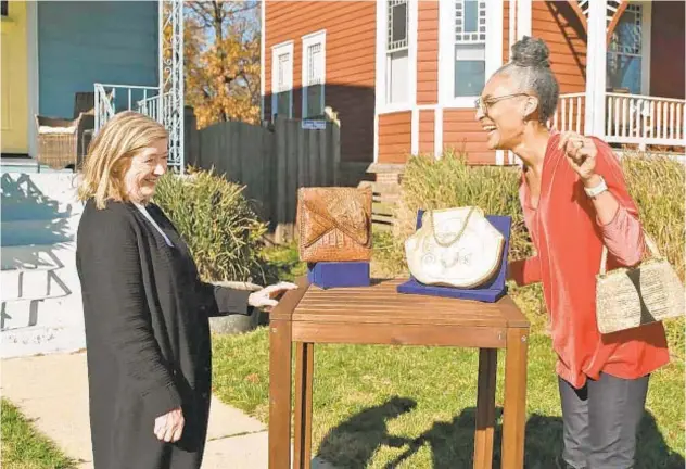  ?? WGBH/PBS ?? Katy Kane, left, appraises celebrity chef Carla Hall’s vintage purse collection.