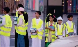  ??  ?? The volunteers leave a positive impact on those receiving the Iftar packages in Dubai.