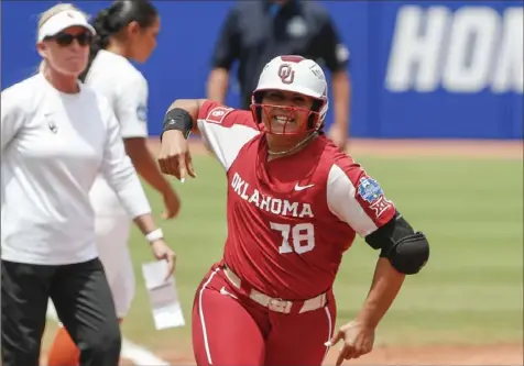  ?? Alonzo Adams/Associated Press ?? Jocelyn Alo hit a two--run home run in the first inning to jump-start No. 1 Oklahoma to a 7-2 win against Texas Saturday in a College World Series softball game in Oklahoma City, Okla.