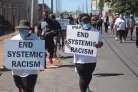  ?? A member of the Memphis City Council ?? Members of the Temple of Deliveranc­e COGIC march with members of the NAACP, calling for an end to police violence on Saturday.